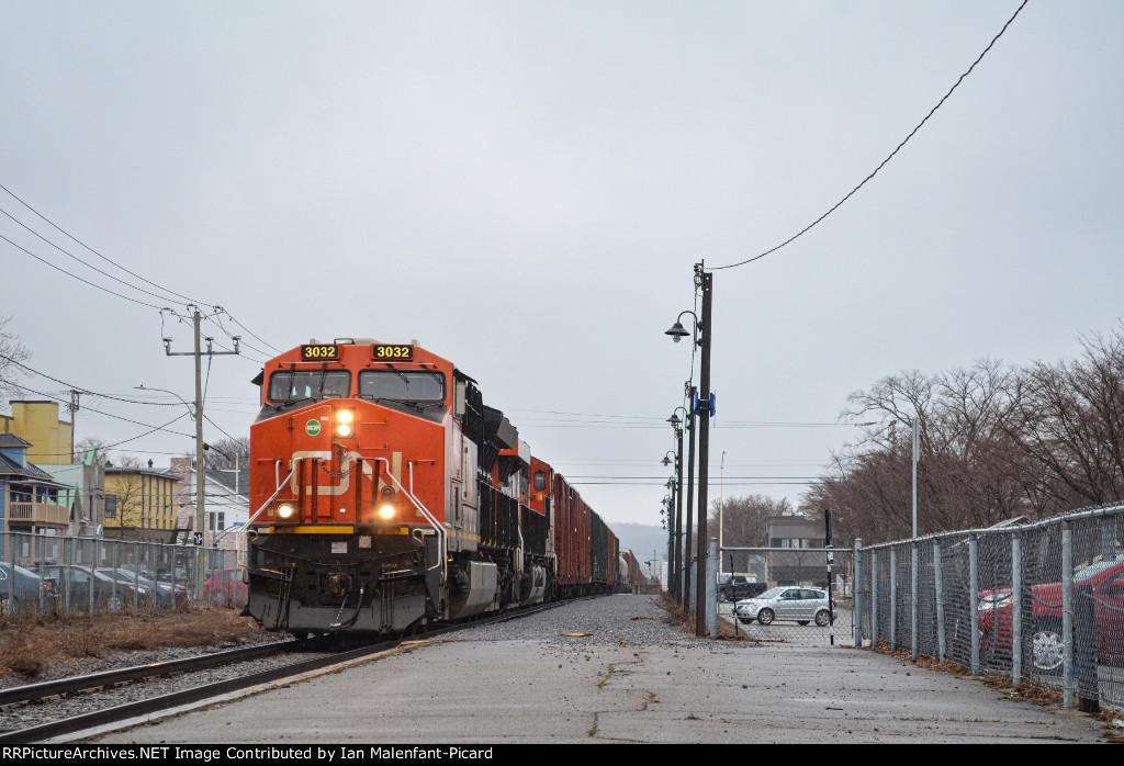3032 leads CN 402 at Rimouski Station